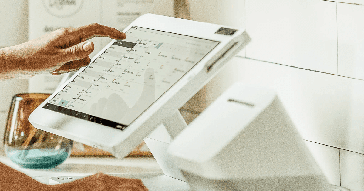 Merchant reviewing free POS program contract and payment processing terms, Atlanta Georgia small business equipment qualification