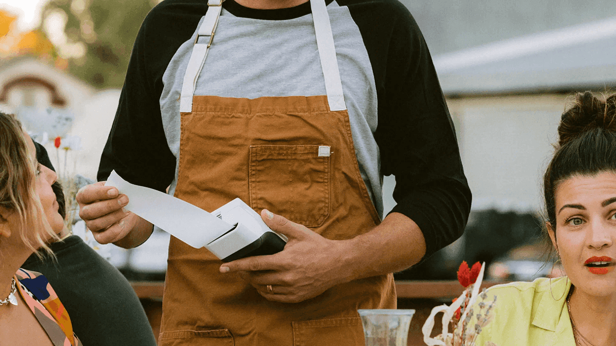 Developer laptop with website code, building a payment-ready business website