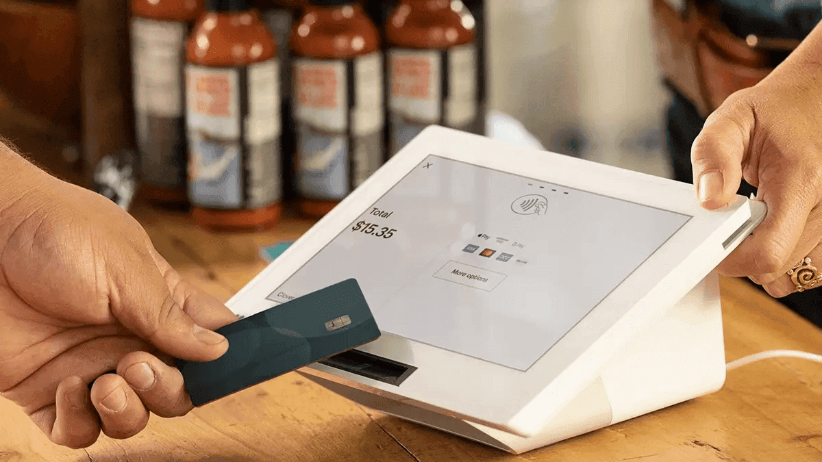 Developer laptop with website code, building a payment-ready business website