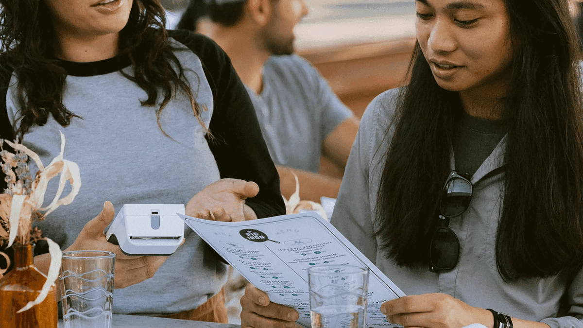 Developer laptop with website code, building a payment-ready business website