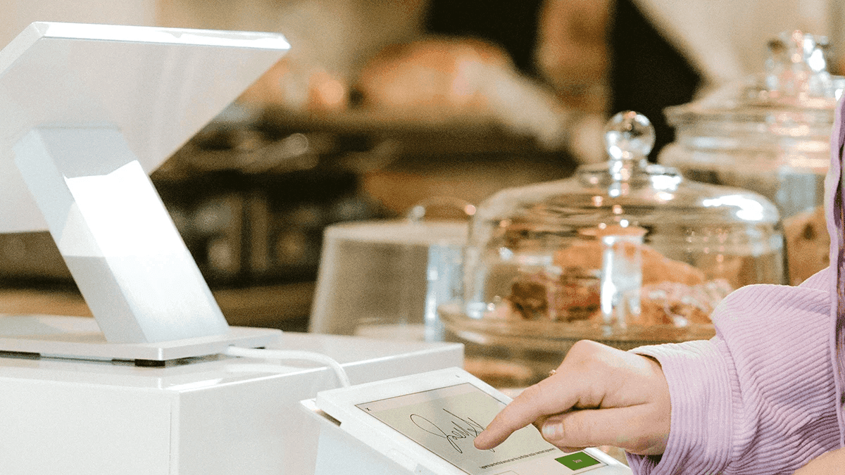 Developer laptop with website code, building a payment-ready business website