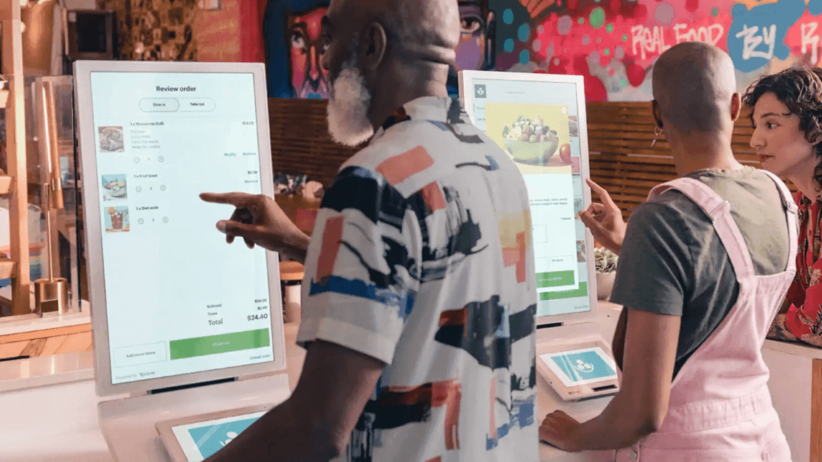 Developer laptop with website code, building a payment-ready business website