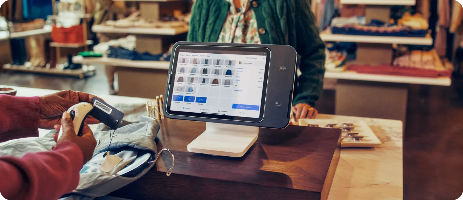 Square Stand scanning a barcode on apparel in a retail shop